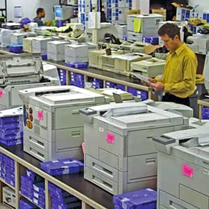 An employee testing printer toner and components in Static Control's print lab