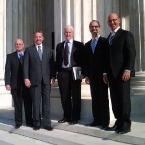 Static Control executives standing in front of a government building