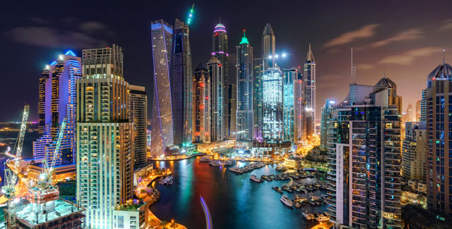 A picture of two men on a tall building in Dubai