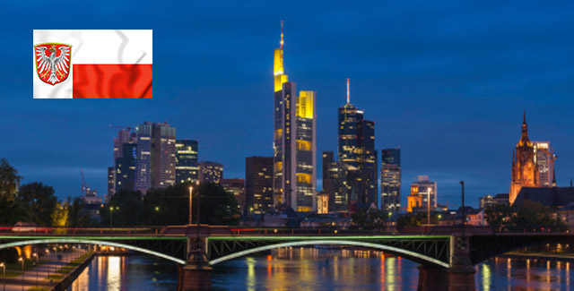 A city skyline with the Frankfurt flag over the top left of the photo
